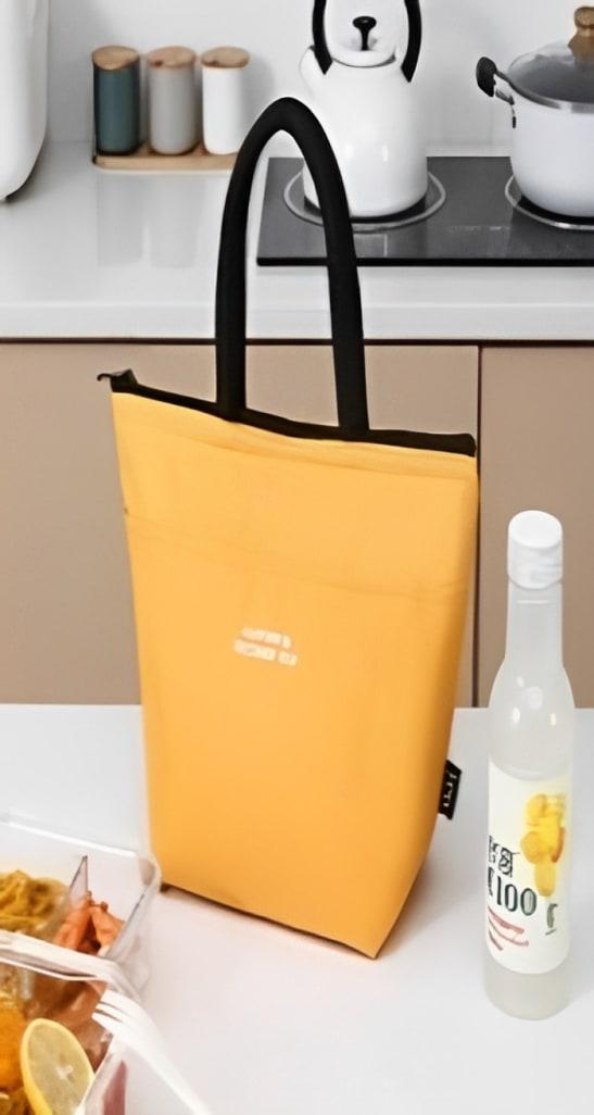 Office worker with front pocket beige lunch bag