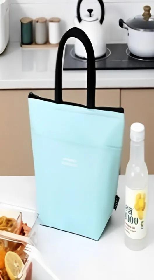 Office worker with front pocket light blue lunch bag