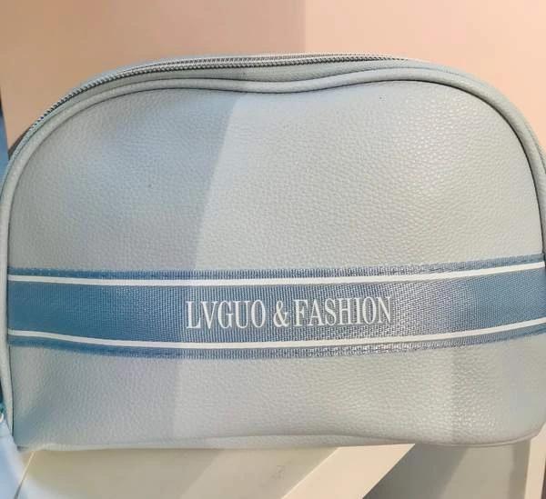 Litchi pattern woven belt semicircle makeup bag